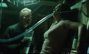 The Dollmaker killing one of his victims.