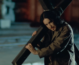 Jonny holding a cross