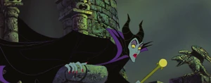 Maleficent shocked when she sees Phillip escaping with the three good fairies.