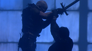 The Kurgan crossing swords with MacLeod/Russell Nash.