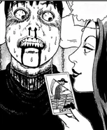 Fortune Teller torturing Tomio.