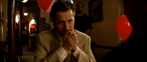 Stansfield interrogating Tony on Léon's whereabouts.