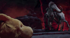 Kazar sneers as he approaches the unconscious cub.