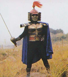 Armored Knight wielding one of his swords.