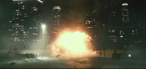 The destroyed helicopter lands on top of the car park.