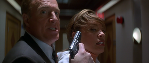 DeGuerin holding Lee Cullen hostage before escaping from Cyrez HQ.