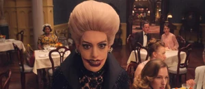 The Grand High Witch furious and shocked to see all of her followers turning into rats due to her their soup having been doused with her formula.