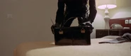 Lynch making off with the money after killing Lisa