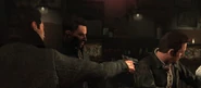 Tony pointing his gun at Max Payne.