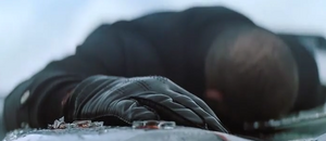 Bond leaving an unconscious Hinx, believing him to be dead.