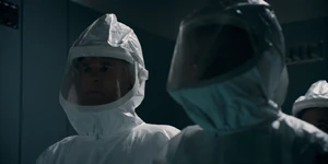 Brenner in the elevator with some scientists.