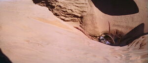 Boba Fett falls into the sarlacc pit on Tatooine.