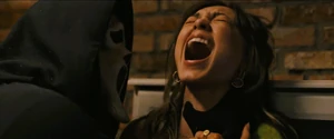 Ethan stabs and rips open Anika's stomach.