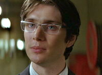 Scarecrow without his mask as Dr. Jonathan Crane.