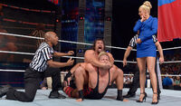 Battleground 2014: Showing the power she has, as she enjoys watching Rusev use The Acolade, as the referees tell her to stop him