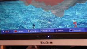 The Dark Lord covers in fear as the computer is getting destroyed.