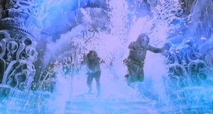 A blast of energy emanates from the pod down into the room overloading the equipment spitting sparks and flames with two Dwergi jumping away.