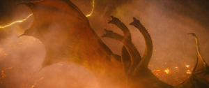 Ghidorah unleashing a piercing shriek as he awakens all the Titans around the globe.