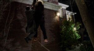 Harry and Marv swinging into a brick wall.