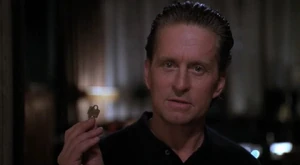 Taylor holding Emily's key, threatening.