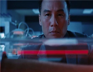 Mr. Henry Wu using a part of the Indominus rex's skeleton to make the Indoraptor.