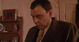 Durant searching the apartment of his henchman Pauly, before killing him.