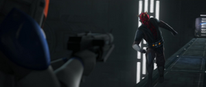 A clone trooper holds Maul at blaster point as he rushes towards him.