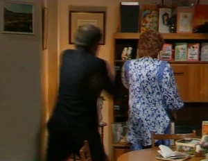 Alan goes to attack Rita in a fit of rage.