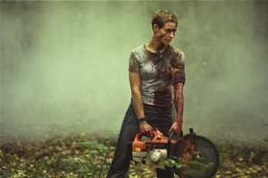 Marie holding the Concrete Saw.