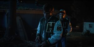 Later at night, Andy approaches Jason as he trains with his gun.