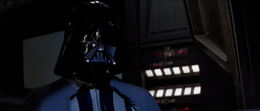 Vader stands as the Emperor explains that his father was irredeemable and could never be turned from the dark side.