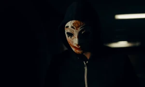 A masked Ben about to kill an anti-Purge co-ed.