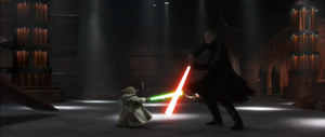 Yoda and Dooku engaged in a lightsaber duel.