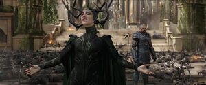 Hela relishes in a malevolent victory after slaughtering the entire Asgardian Einherjar army in a single combat while Skurge looks on the carnage with a deafening dismay.