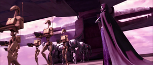 Asajj Ventress observes droid reinforcements arrive on Teth.