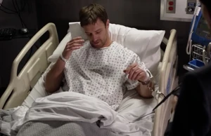 Greg in police custody.