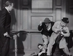 Grover watching the 3 bodyguards subdue the wrong person