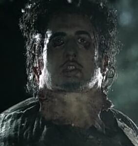 Leatherface wearing Kemper's face as a mask.