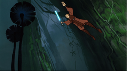 Anakin leaps through the air avoid the assassin's strikes.