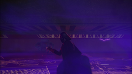 Vader turns around to see Ahsoka while still holding on to the holocron with the Force.