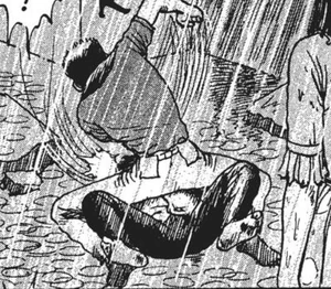 Goda beating up Kunihiro Mineishi.