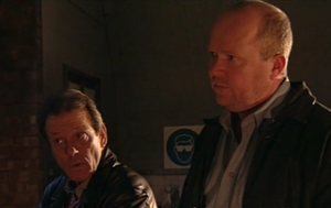 Phil Mitchell and Dirty Den contemplate on Dennis' potential for their armed robbery plan.