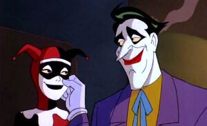 Joker grabbing Harley's cheek until the latter mentions what a guy he is.