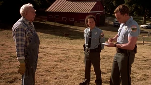 Sisk and Mange questioning a farmer