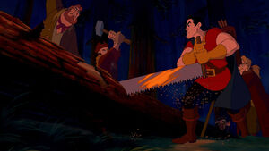 Gaston and his buddies having cut down a tree, in order to use its trunk to break into the castle.