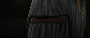 A close-up of Dooku grinning as he watches the monitors.