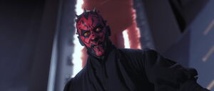 Maul stares down at Obi-Wan in the chamber.