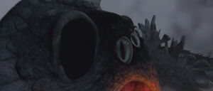 Red Death's eyes widen in horror as he realizes too late Hiccup and Toothless tricked him into diving to the ground without noticing.