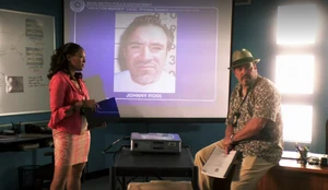 Maria and Angel presenting Johnny's mugshot.