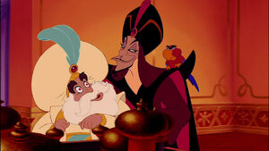 Iago as Jafar lets the hypnotized Sultan do his own business.